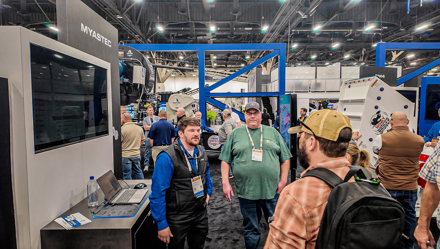 MyAstec demo area at ConExpo 2026, attendees engage in conversation with Brennan Morrow for the MyAstec demo on the ConExpo show floor.