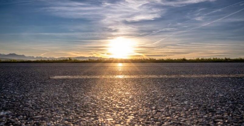 Asphalt road in sunset
