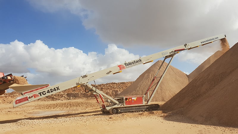 TC424X stockpiling 44mm road base with Terex Finlay 1-130RS
